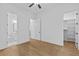 Spacious bedroom features hardwood floors and a hallway leading to closet and bathroom at 6132 Hutchins Dr, Buford, GA 30518