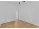 A empty bedroom with hardwood flooring, bright white walls and a ceiling fan at 6132 Hutchins Dr, Buford, GA 30518