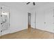 Bedroom featuring hardwood floors and attached bathroom at 6132 Hutchins Dr, Buford, GA 30518
