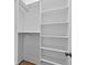 Walk-in closet with built in shelving and metal hanging bars at 6132 Hutchins Dr, Buford, GA 30518