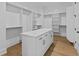 Walk-in closet with custom shelving and island offering ample storage at 6132 Hutchins Dr, Buford, GA 30518