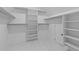 Spacious walk-in closet with custom shelving and ample storage space at 6132 Hutchins Dr, Buford, GA 30518