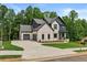 Charming two-story home with brick, siding, and a two car garage at 6132 Hutchins Dr, Buford, GA 30518