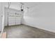 A clean and spacious garage with an automatic door and neutral walls for a modern, functional space at 6132 Hutchins Dr, Buford, GA 30518