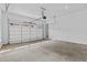 Spacious garage with overhead door and white painted walls at 6132 Hutchins Dr, Buford, GA 30518