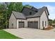 View of a two car garage attached to a home at 6132 Hutchins Dr, Buford, GA 30518
