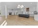 Open-concept kitchen featuring a large island, stainless steel appliances, and modern finishes at 6132 Hutchins Dr, Buford, GA 30518