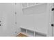 Bright, modern mudroom with a built-in bench, cubbies, and storage space at 6132 Hutchins Dr, Buford, GA 30518