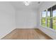 A bright home office space with panel moulding and natural light from a large window at 6132 Hutchins Dr, Buford, GA 30518