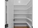 A pantry with white shelving for optimal storage at 6132 Hutchins Dr, Buford, GA 30518