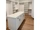 Well-organized walk-in closet with custom shelving and a central island for storage and convenience at 6132 Hutchins Dr, Buford, GA 30518