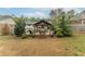 Landscaped backyard featuring a gazebo and outdoor seating, creating a serene retreat at 1337 Frontier Trl, Sugar Hill, GA 30518