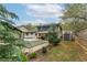 Scenic backyard view featuring a pool, deck, and well-kept lawn, creating a private outdoor oasis at 1337 Frontier Trl, Sugar Hill, GA 30518