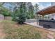 Expansive backyard featuring a gazebo, pool, hot tub, and covered patio, offering a variety of outdoor amenities at 1337 Frontier Trl, Sugar Hill, GA 30518