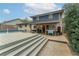 Inviting backyard with a pool, deck, and covered patio, perfect for outdoor gatherings and relaxation at 1337 Frontier Trl, Sugar Hill, GA 30518
