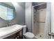 Bathroom featuring a modern vanity, toilet, and stand up shower with curtain at 1337 Frontier Trl, Sugar Hill, GA 30518