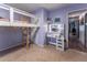 Bedroom featuring a lofted bed, vanity and light purple walls at 1337 Frontier Trl, Sugar Hill, GA 30518