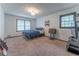Bedroom with neutral walls, natural light and wood-look floors at 1337 Frontier Trl, Sugar Hill, GA 30518