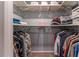 Walk-in closet with upper shelving, hanging racks and ample storage space at 1337 Frontier Trl, Sugar Hill, GA 30518