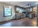 Modern kitchen features stainless steel appliances, wood countertops, and open shelving at 1337 Frontier Trl, Sugar Hill, GA 30518