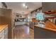 Modern kitchen with stainless steel appliances, butcher block counters, and stylish cabinetry at 1337 Frontier Trl, Sugar Hill, GA 30518