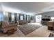 Bright and airy living room with neutral walls, hardwood floors, and lots of natural light at 1337 Frontier Trl, Sugar Hill, GA 30518