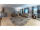 Spacious living room with plush carpeting, large windows, and ample seating at 1337 Frontier Trl, Sugar Hill, GA 30518