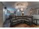 Basement Gathering room with a large sectional sofa and hardwood-style floors at 1337 Frontier Trl, Sugar Hill, GA 30518