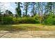 Sunny backyard featuring green shrubs and lawn for outdoor enjoyment at 2867 Payton Ne Rd, Atlanta, GA 30345