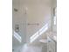 Bright bathroom with glass shower door, white subway tiles and a white vanity at 2867 Payton Ne Rd, Atlanta, GA 30345
