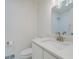 Bathroom with a modern vanity, toilet and mirror at 2867 Payton Ne Rd, Atlanta, GA 30345