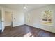 Bright bedroom featuring hardwood floors, two windows, and neutral paint at 2867 Payton Ne Rd, Atlanta, GA 30345