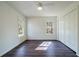 Bright bedroom boasts two windows, wood floors, and a closet at 2867 Payton Ne Rd, Atlanta, GA 30345