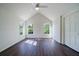 Spacious bedroom with high ceiling, a ceiling fan and three windows with outside views at 2867 Payton Ne Rd, Atlanta, GA 30345