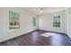 Well-lit bedroom features wood floors and two large windows at 2867 Payton Ne Rd, Atlanta, GA 30345
