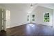 Bright bedroom with vaulted ceiling, three windows and hard wood flooring at 2867 Payton Ne Rd, Atlanta, GA 30345