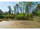 Wide angle shot of the spacious outdoor deck with wood railings, perfect for entertaining at 2867 Payton Ne Rd, Atlanta, GA 30345