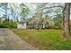 Charming home with a well-manicured lawn and blooming tree at 2867 Payton Ne Rd, Atlanta, GA 30345
