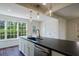 Open kitchen with large island, stainless steel appliances, and a view of the outdoors at 2867 Payton Ne Rd, Atlanta, GA 30345