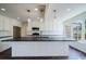 Bright kitchen features a large island, white cabinetry, stainless steel appliances, and natural light at 2867 Payton Ne Rd, Atlanta, GA 30345