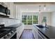 This kitchen features an island, stainless steel appliances, and white subway tile at 2867 Payton Ne Rd, Atlanta, GA 30345