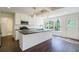 Bright, modern kitchen features a large island, stainless appliances, and a view to the outdoors at 2867 Payton Ne Rd, Atlanta, GA 30345