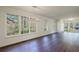 Spacious living room with hardwood floors and lots of natural light from large windows at 2867 Payton Ne Rd, Atlanta, GA 30345