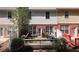 Charming backyard view showcasing the deck, brick facade, and well-maintained landscaping at 545 Woodland Park Ter, Lawrenceville, GA 30043