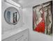 Contemporary bathroom boasts a round mirror with a decorative frame and artistic wall decor at 545 Woodland Park Ter, Lawrenceville, GA 30043