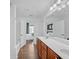 This bathroom boasts a double sink vanity and lots of natural light at 545 Woodland Park Ter, Lawrenceville, GA 30043