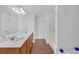 The bathroom has dual sinks and a large mirror over a long vanity at 545 Woodland Park Ter, Lawrenceville, GA 30043