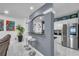 Kitchen with bar seating, stainless appliances, and an open view to living area at 545 Woodland Park Ter, Lawrenceville, GA 30043