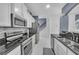 Well-equipped kitchen with granite countertops, stainless steel appliances, and modern backsplash at 545 Woodland Park Ter, Lawrenceville, GA 30043