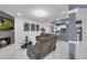 Open living room with fireplace, gray walls, tile floors, recessed lighting, and modern furnishings at 545 Woodland Park Ter, Lawrenceville, GA 30043